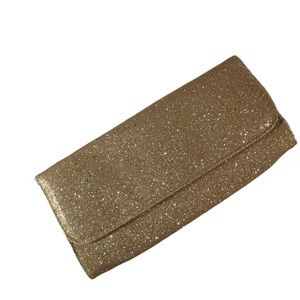 Gold clutch bag. Bare essentials. Great for holidays